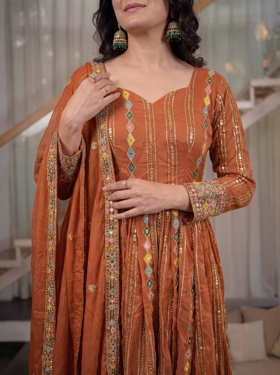 Radiant Rust Orange Flared Anarkali Suit Set Adorned with Multicolored Geometric Embroidery and Dazzling Mirror Work Detailing